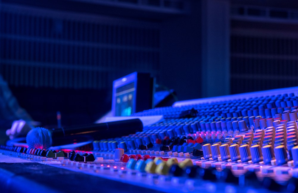 Technical Director running sound board at an event